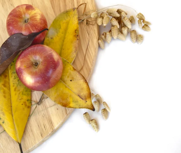 Apples and fallen leaves — Stock Photo, Image
