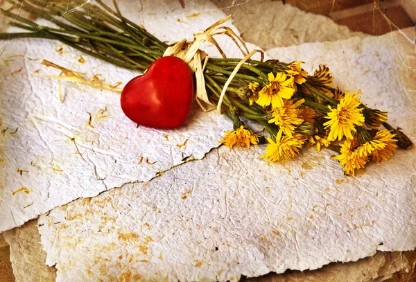 Bouquet of dandelions with red heart — Stock Photo, Image