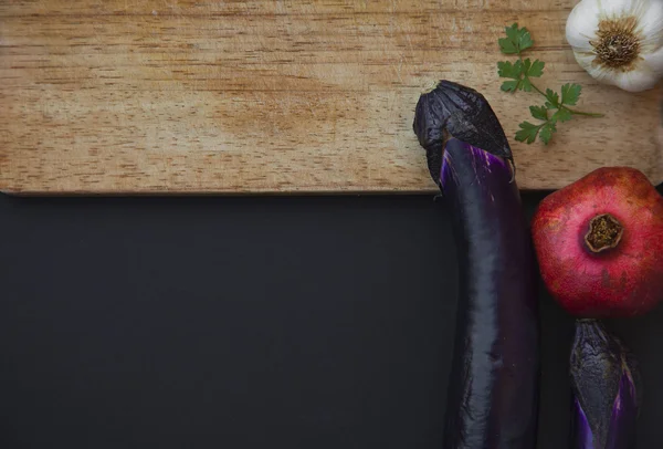 Pomegranat fruit, garlic, eggplant and parsley — Stock Photo, Image