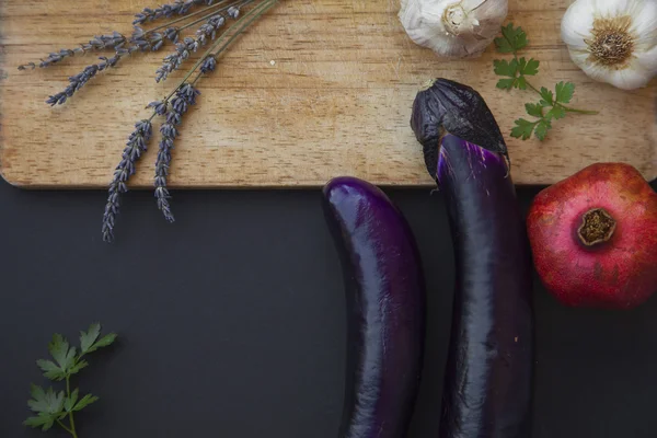 Pomegranat fruit, garlic, eggplant and parsley — Stock Photo, Image