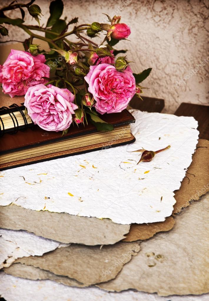 Roses, old books and handmade paper