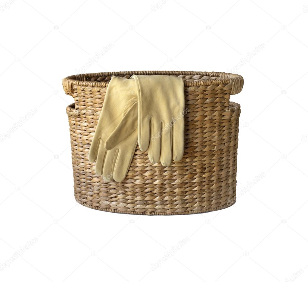 Fashion leather gloves on wicker basket