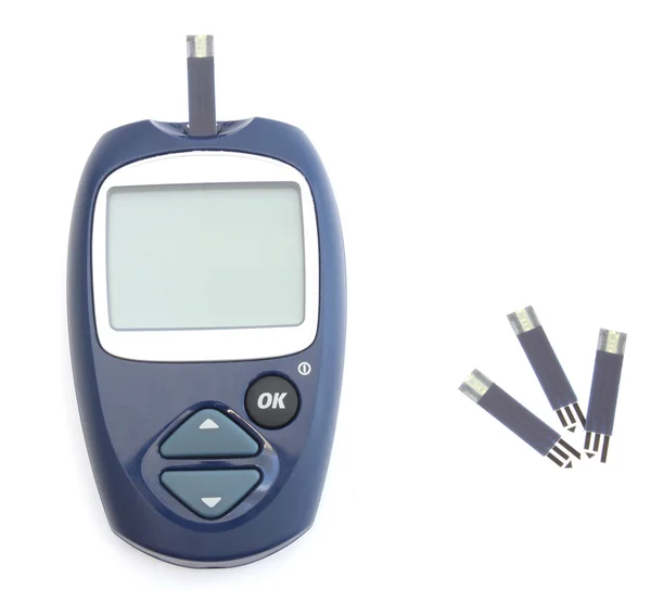 Glucometer en de test strips — Stockfoto