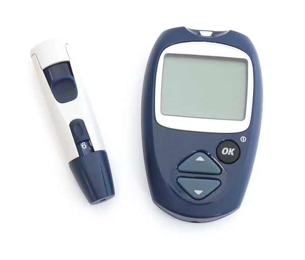 Glucometer en de test strips — Stockfoto