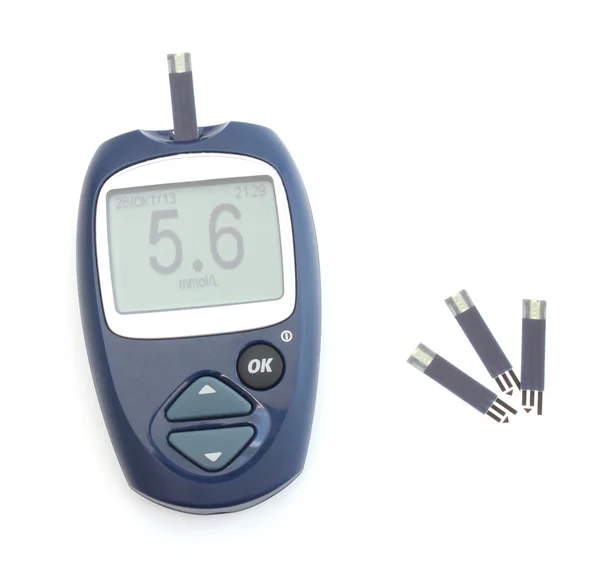 Glucometer en de test strips — Stockfoto