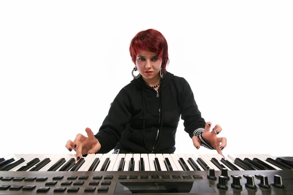 Girl playing on keyboards — Stock Photo, Image