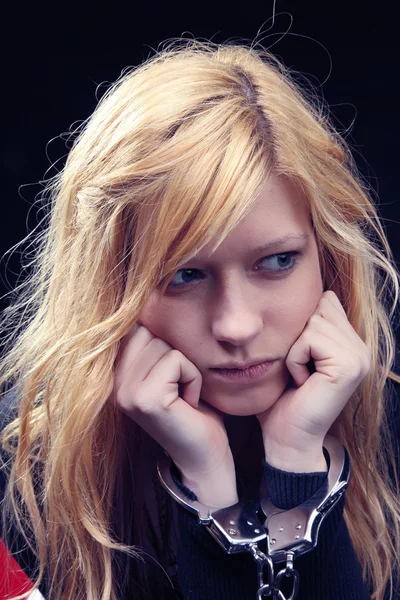 Blonde girl with handcuffs — Stock Photo, Image