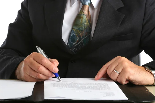 Businessman signing a contract Stock Image