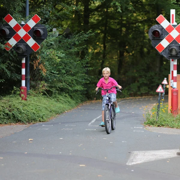 Boy cycling after school on bike — Stock Photo, Image