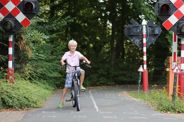 Boy cycling on bike at special training playground — Stock Photo, Image