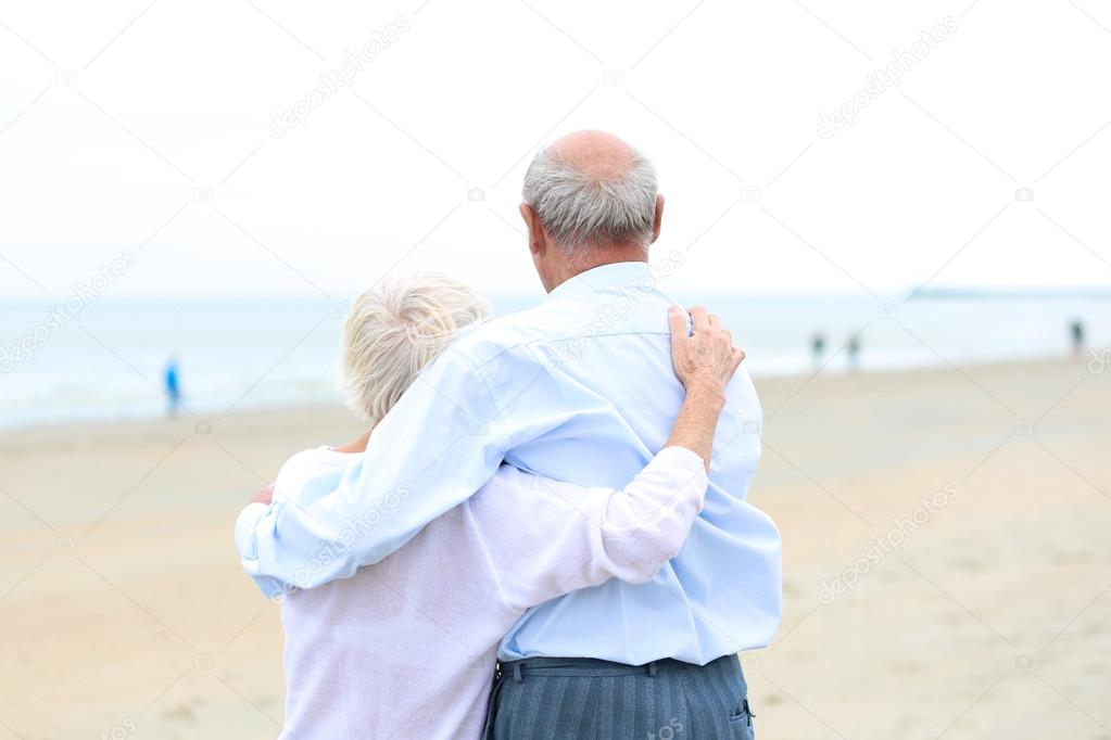 Couple standing together on beach