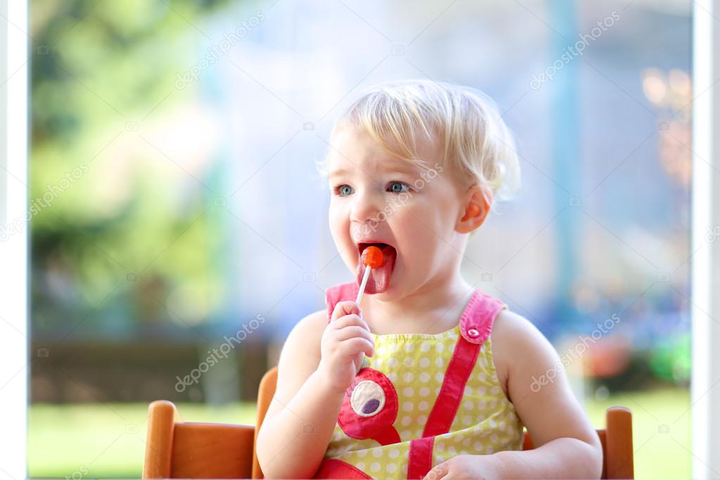 Girl eating lollipop