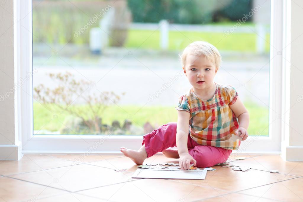 Girl playing with puzzles
