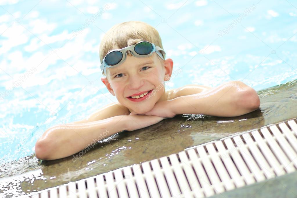 Boy swimming in outdoor pool