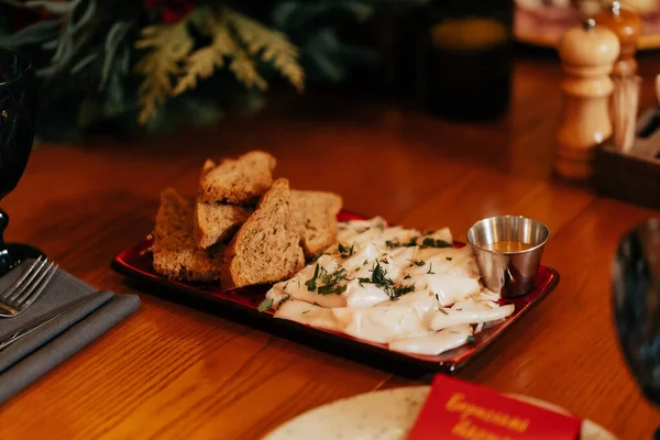 Ukrainian Bacon Appetizer Black Bread Sauce Plate Table — 图库照片