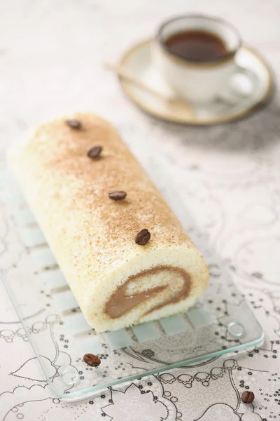 Coffee Swiss Roll Cake on light background — Stock Photo, Image