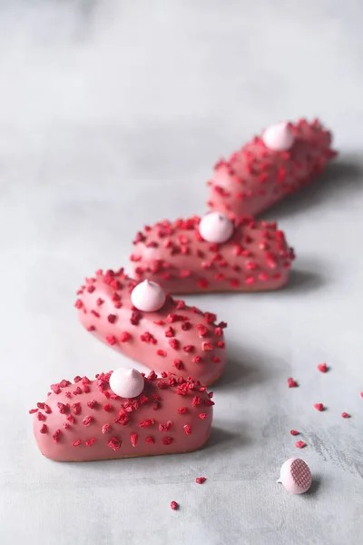 Pink Eclair Raspberry Cream Filling Covered Pink Chocolate Sprinkled Freeze 로열티 프리 스톡 사진