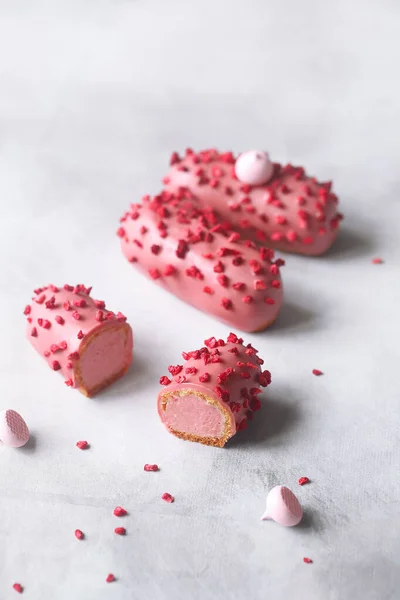 Pink Eclair Raspberry Cream Filling Covered Pink Chocolate Sprinkled Freeze Стоковая Картинка