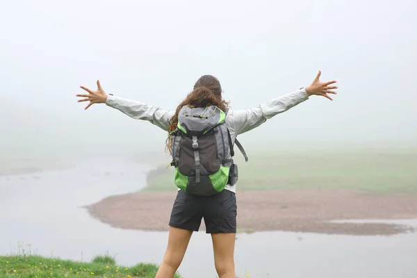 Back View Portrait Hiker Outstretching Arms Mountain Foggy Day — Zdjęcie stockowe