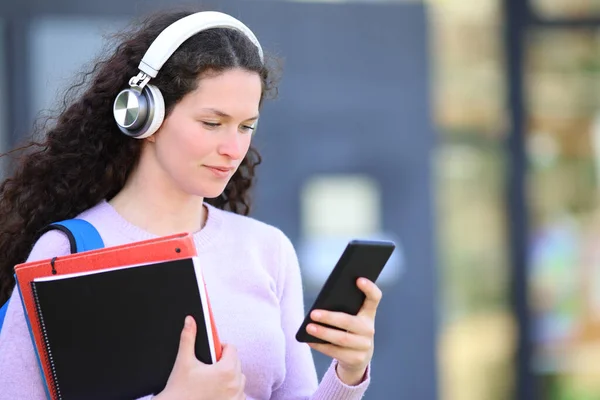 Serious Student Holding Folders Checking Smart Phone Standing Campus — Stok fotoğraf