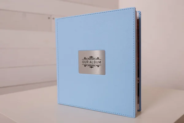 Photobook Photoalbum Light Blue Leather Cover White Table Background Metallic — Fotografia de Stock