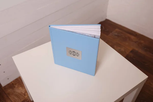 Photobook Photoalbum Light Blue Leather Cover White Table Background Metallic — стоковое фото