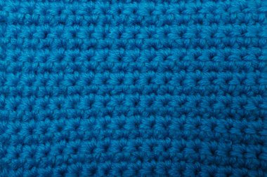 Mavi kumaş dokusu, arkaplan ya da arkaplan örer. Tekstil, atkı ya da süveter desenli yüzey. Sıcak aksesuarlar, kıyafetler, moda konsepti