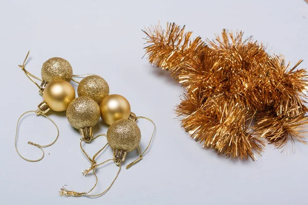 Golden Colored Christmas Tree Decorations Baubles Bulbs Tinsel Light Background — Stockfoto