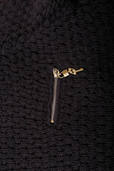 Metallic Zipper Lock Key Knitted Black Cloth Background — Stock Photo, Image
