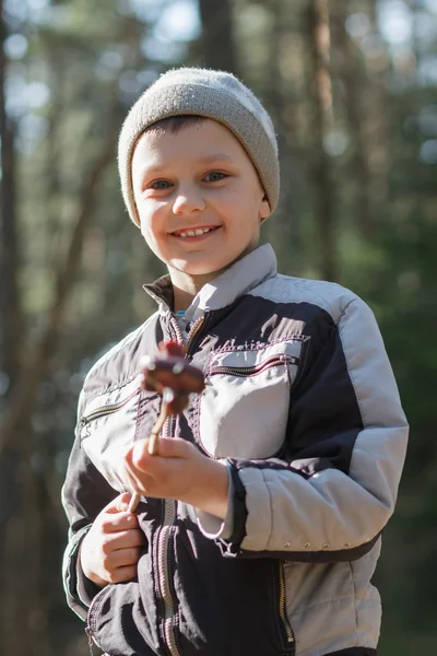 Smiling boy on the barbecue — Stock Photo, Image