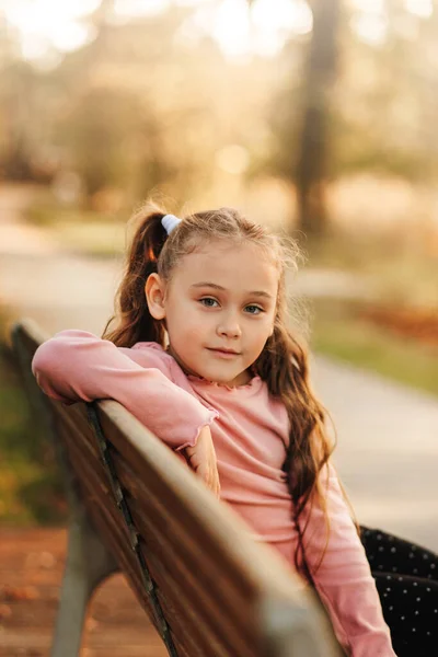 Little Pretty Girl Sits Bench Park Autumn — Stock Photo, Image
