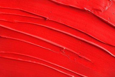 Kırmızı boya dokusu. Kırmızı ruj arkaplanı. Üst görünüm