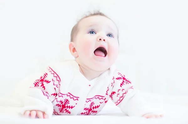 Baby wearing a knitted sweater with Christmas ornament — Stock Photo, Image