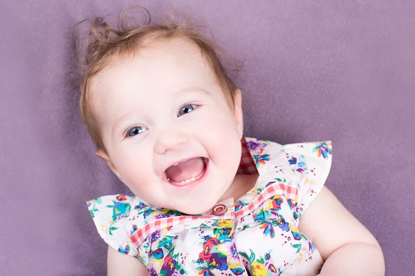 Baby girl on a purple blanket — Stock Photo, Image