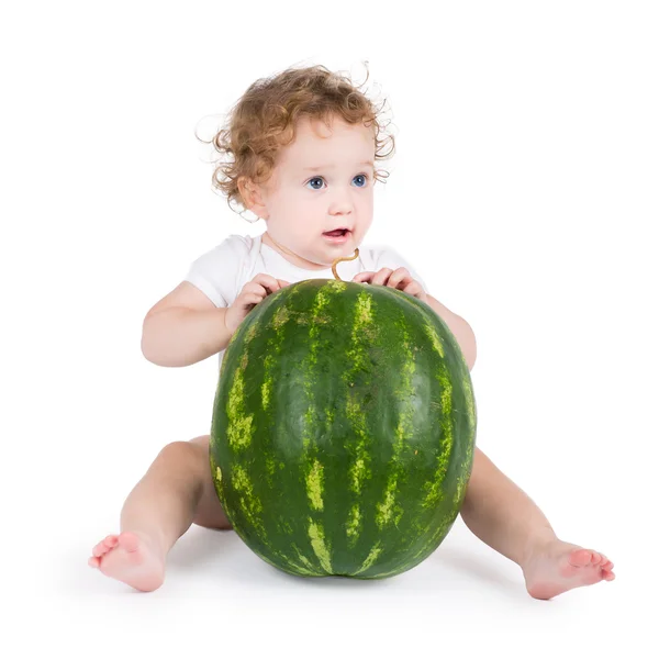 Funny little baby with a big watermelon — Stock Photo, Image