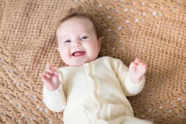 Baby on a knitted blanket — Stock Photo, Image