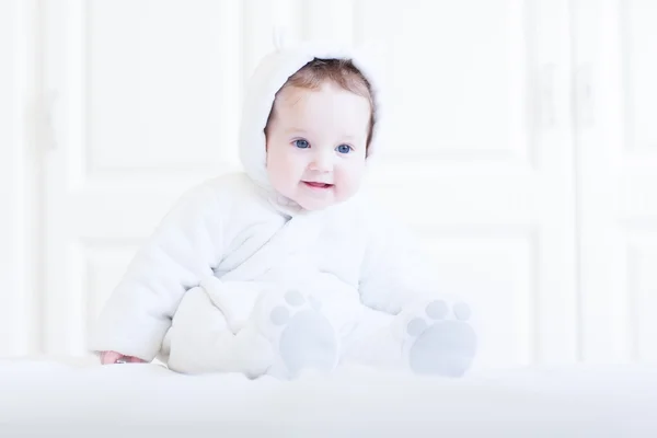 Funny baby wearing a teddy bear snow suit — Stock Photo, Image