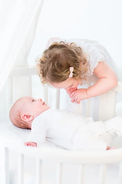 Toddler girl kissing the hand of brother — Stock Photo, Image