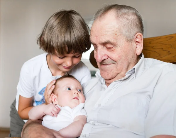 Grandfather holding baby girl — Stock Photo, Image