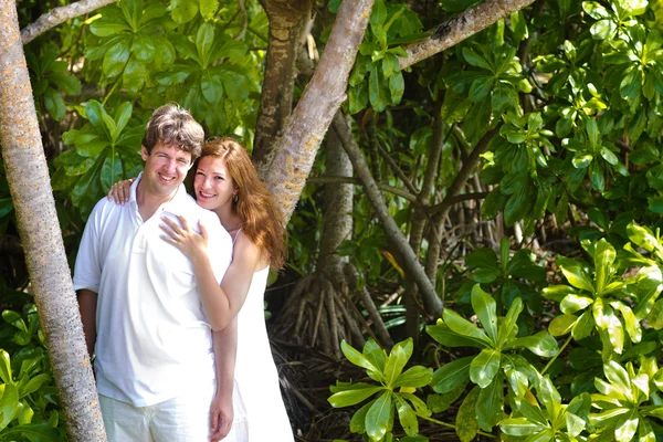 Couple in a tropical jungle — Stock Photo, Image