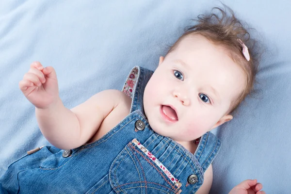 Baby in a jeans dress — Stock Photo, Image