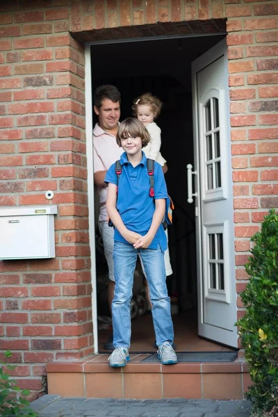 Boy leaving home for his first day back to school — Stock Photo, Image