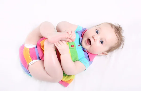 Baby girl in a colorful dress — Stock Photo, Image