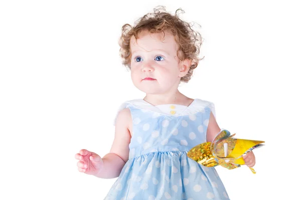 Baby girl playing with a wind toy — Stock Photo, Image