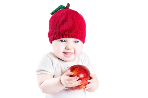 Bebé con una gran manzana roja —  Fotos de Stock