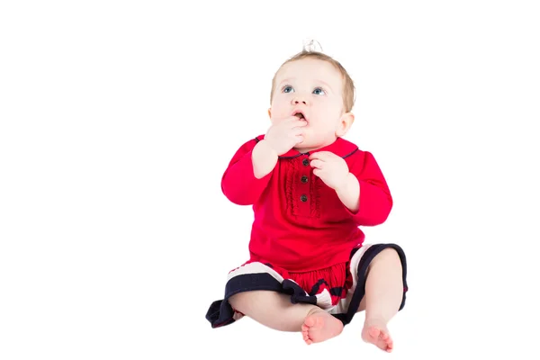 Cute baby girl in a red dress — Stock Photo, Image