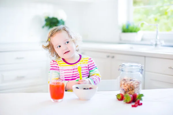 Beautiful toddler girl having breakfast — Stock Photo, Image