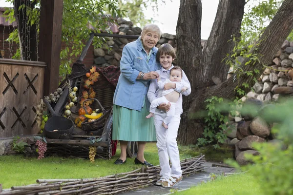 Happy grandmother with her grandchildren — Stock Photo, Image