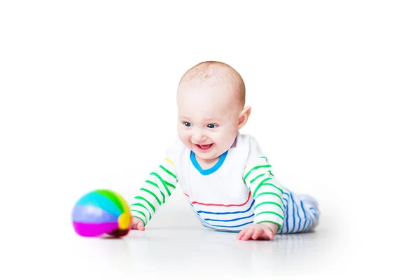 Happy laughing funny baby boy playing on his tummy — Stock Photo, Image