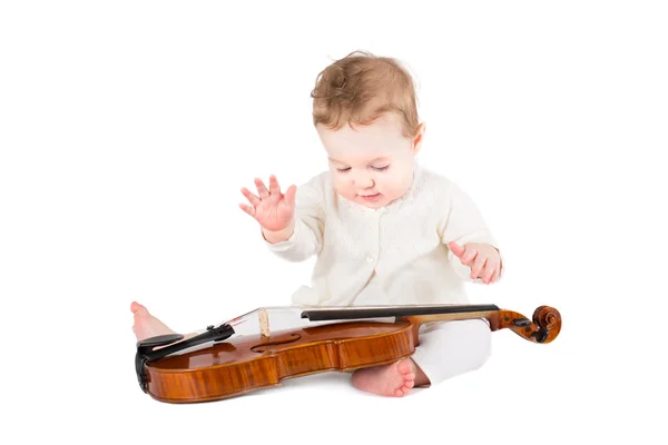 Baby girl playing with a violin — Stock Photo, Image